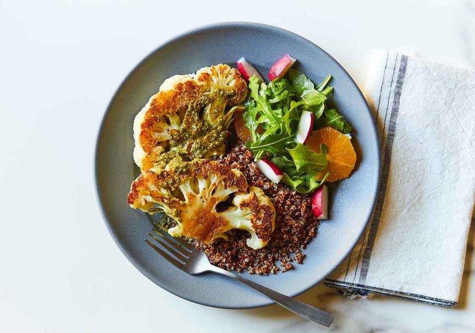 Roasted Cauliflower Pesto Steaks with Arugula Salad and Quinoa Innit
